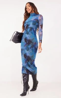 Robe Mi-longue Bleue Fleurie En Mesh à Manches Longues Et Taille Torsadée -Zeze Vetements Magasin 6a513cd2fb424623640e543f92ae95ae097189ef cna9167 3